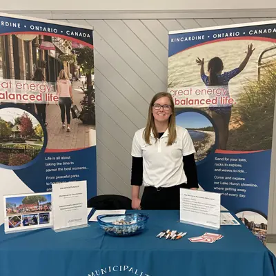 Municipality of Kincardine employee standing in booth at the Career Fair and Job expo