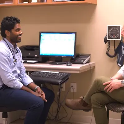 A doctor consults in his office.